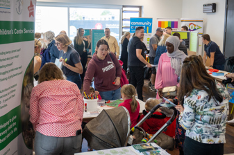 Residents engaging with external stalls at the BGT event