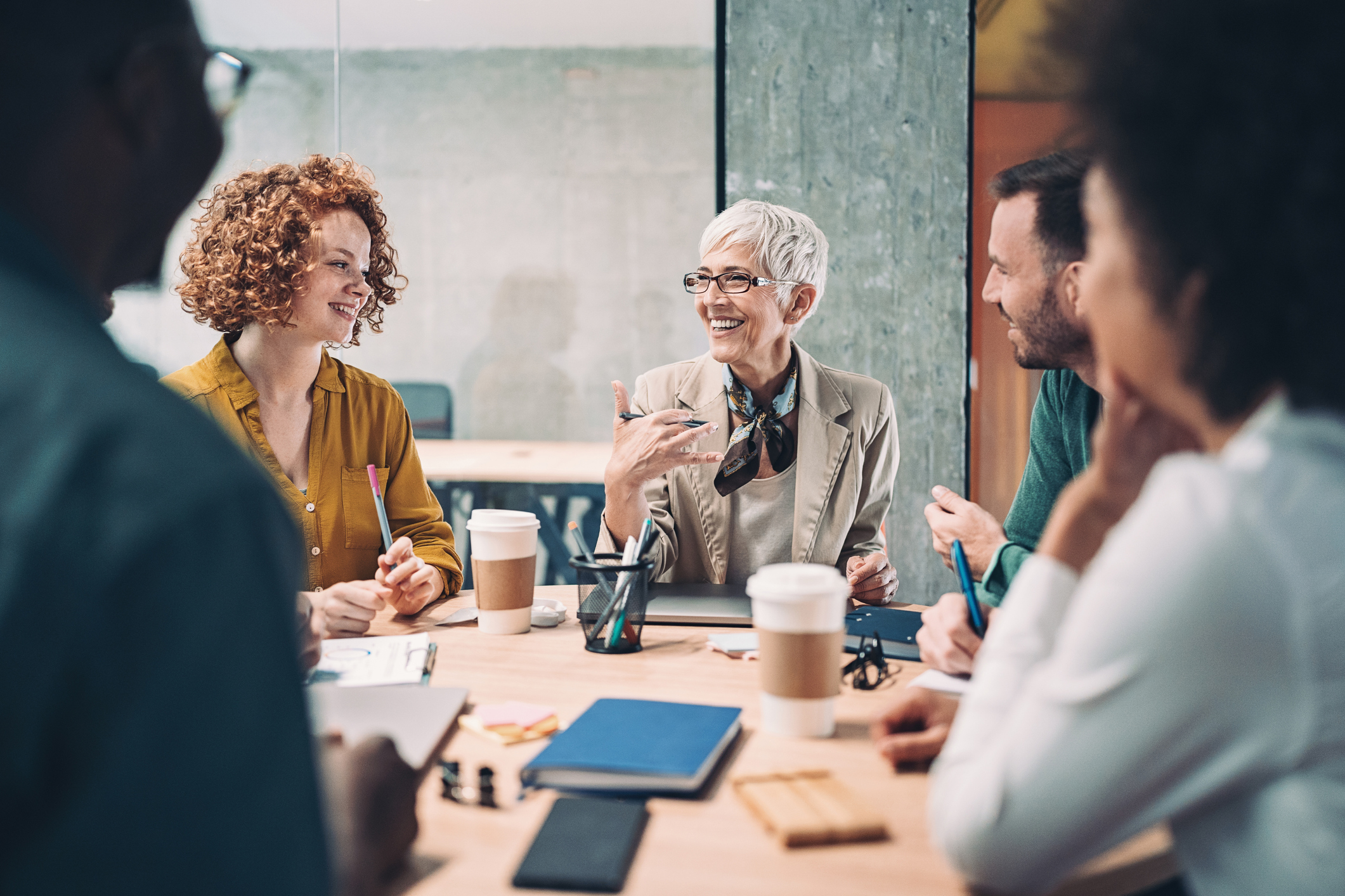 Group of people talking and smiling