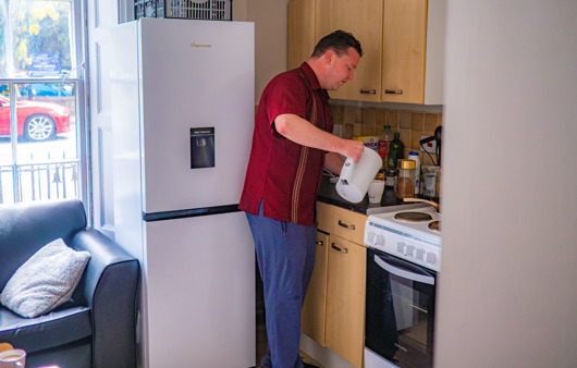 Eddy using his kitchen
