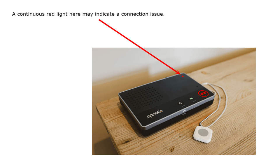 Large black alarm unit on table showing red light in top righthand corner - a continuous red light here may indicate a connection issue