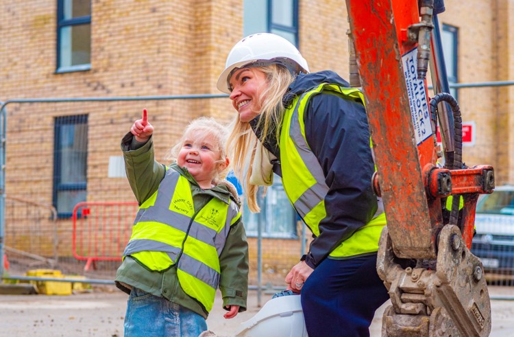 Sarah Maylor with her daughter on the latest development site.