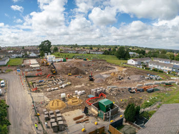 Drone shot over the site shows construction underway