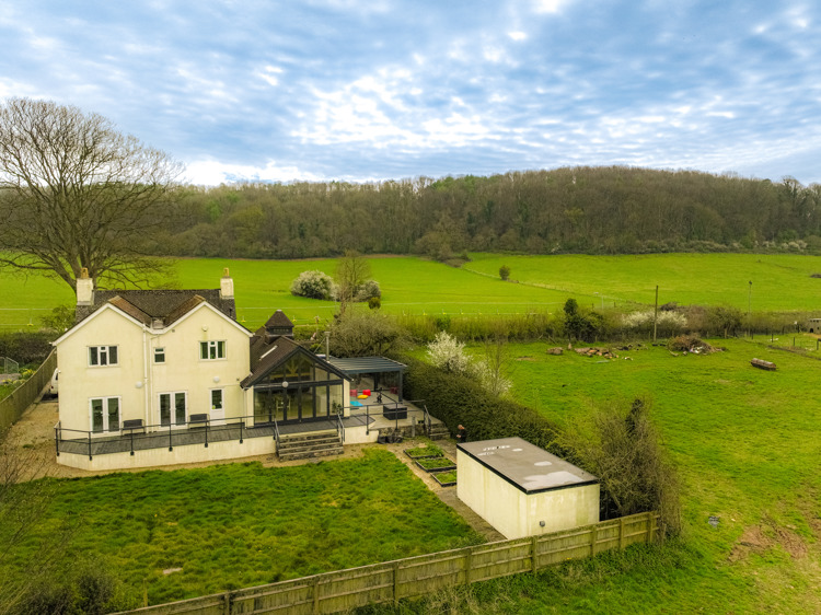 Cream coloured detached house in rural setting