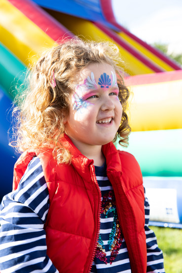Little girl has face painted