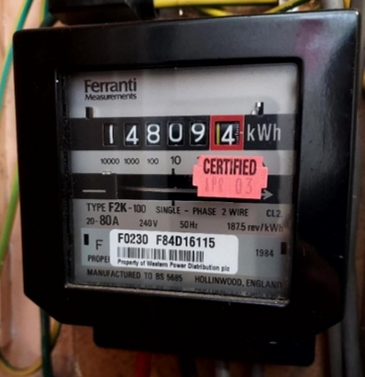 Ferranti electricity meter with a mechanical kWh display and certification sticker.