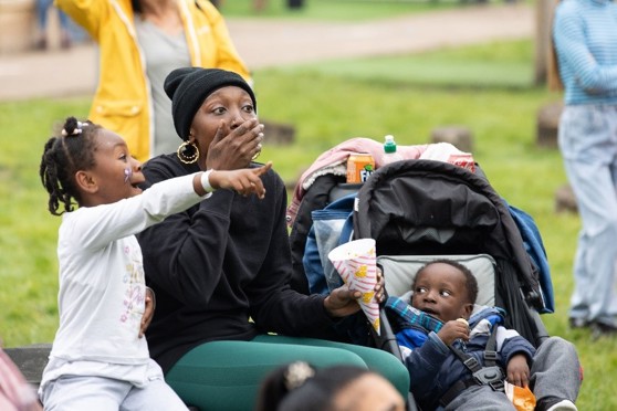 Mum and children enjoying the show