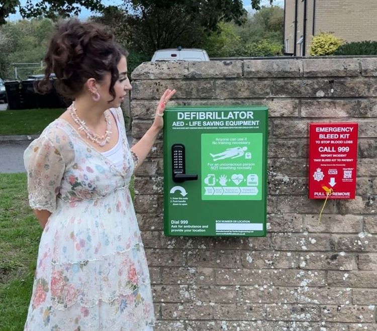 Caitlin unveils the defibrillator