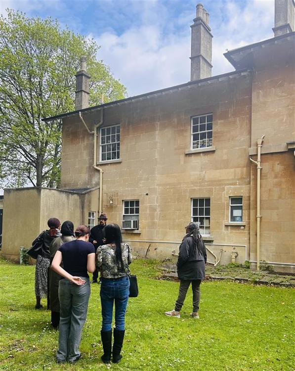 Ras Benji in and the group in the garden at Fairfield House on the famous tour