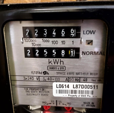 Close-up of a Landis & Gyr electricity meter with separate low-rate and normal-rate kilowatt-hour (kWh) displays, used to record electricity consumption.