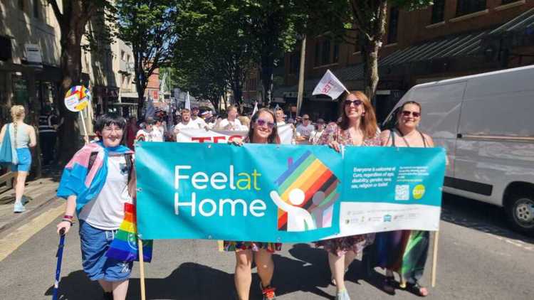 Curo colleagues carrying our 'Feel at Home' banner in the Pride march.