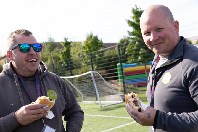 Curo colleagues enjoying some cheeseburgers